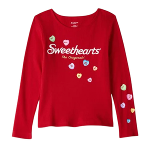 Red long-sleeve shirt featuring the \“Sweethearts The Original\“ logo with decorative candy heart designs scattered across the front and sleeve.
