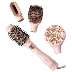 A pink multi-functional hair styling tool with interchangeable attachments, including a round brush, paddle brush, concentrator nozzle, and diffuser.
