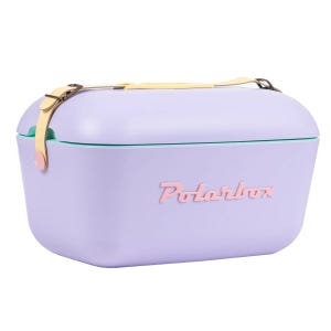 Lavender-colored Polarbox 21-Quart Ice Chest with vintage style, featuring a contrasting pink logo, a leather-like strap for carrying, and a turquoise accent line around the lid.