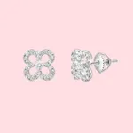 Pair of silver stud earrings with a floral design adorned with small diamonds, set against a pink background.