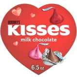 Hershey's Kisses milk chocolate in a heart-shaped package features red, pink, and foil-wrapped chocolates, weighing 6.5 oz.