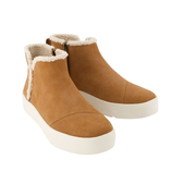 Tan ankle boots with a white platform sole and shearling lining, featuring a side zipper for easy wear.