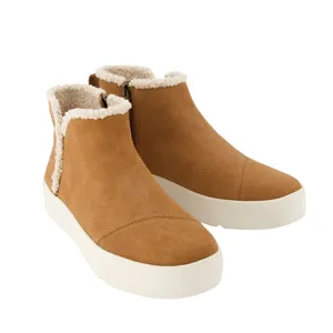 Tan ankle boots with a white platform sole and shearling lining, featuring a side zipper for easy wear.