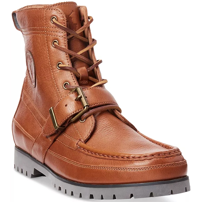 The Ralph Lauren Ranger Tumbled Leather Boot is a high-top, brown leather boot featuring lace-up closures, a decorative buckle, and a rugged, chunky rubber sole. It has detailed stitching and an embossed logo on the side.