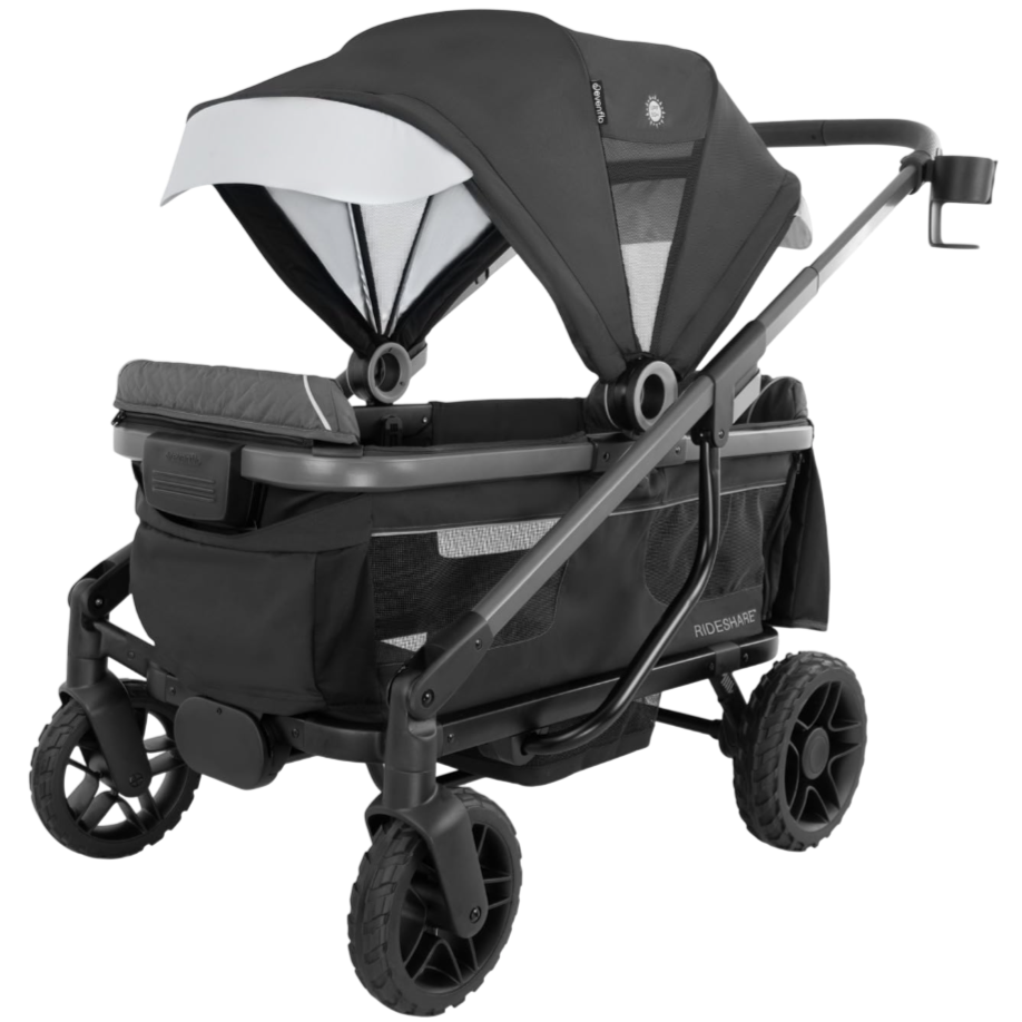 Double stroller with a canopy, large wheels, and a spacious storage area beneath the seating. Designed for two children, with a sleek, modern frame and a cup holder on the handle.