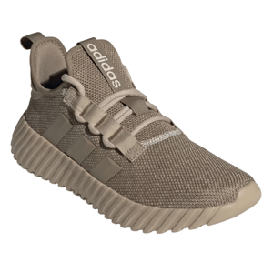 Adidas Kaptir 3.0 shoes feature a tan, knit upper with a textured rubber sole. The design includes three side stripes, a pull tab on the heel, and \“Adidas\“ branding on the tongue.
