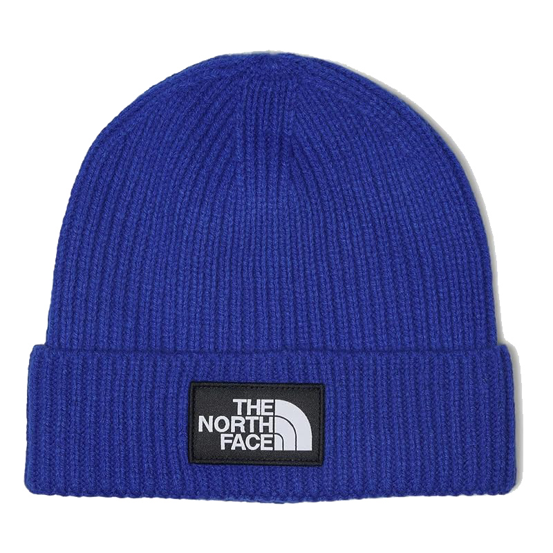 Blue ribbed knit beanie with a cuff, featuring a black patch with the white \“The North Face\“ logo on the front.