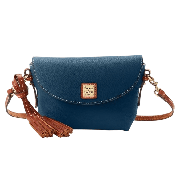 A blue leather crossbody bag with brown accents, featuring a flap closure, gold hardware, a tassel detail, and a logo patch in the center.