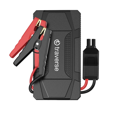 A black power bank jump starter with a rugged design, featuring attached red and black jumper cables, and a clear \“traverse\“ logo on the front.