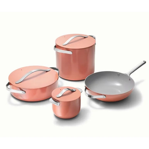 A set of four copper-colored cookware items with lids, including two pots, a pan, and a saucepan.