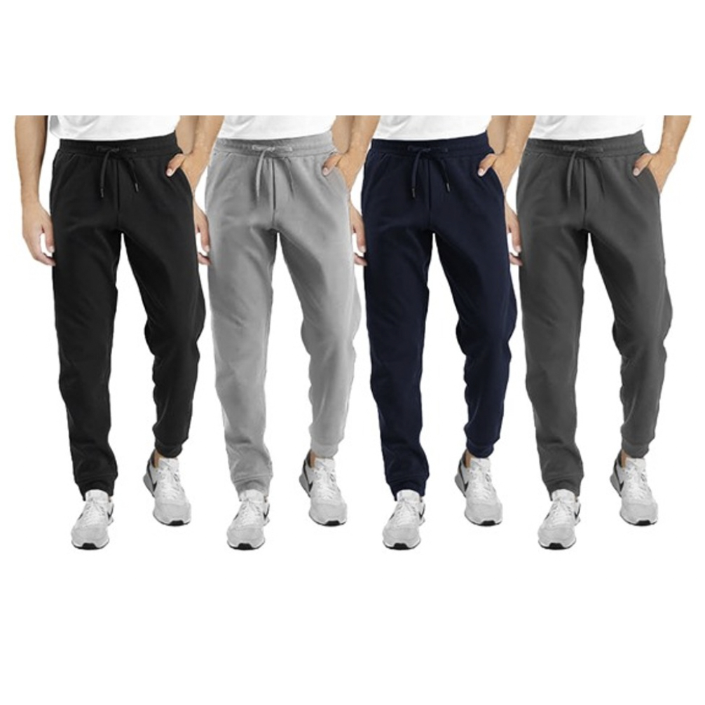 4-pack of men's joggers with drawstring waists in black, light gray, navy, and dark gray colors. Each pair features side pockets and an elastic ankle cuff, paired with white sneakers.
