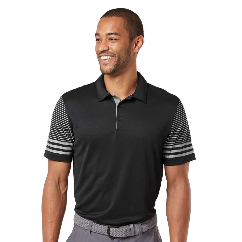 A man is wearing a black polo shirt with striped sleeves and gray pants, accessorized with a textured gray belt.
