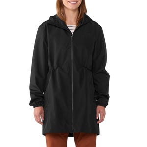 A person is wearing a black long rain jacket with a hood and zipper, paired with brown pants.