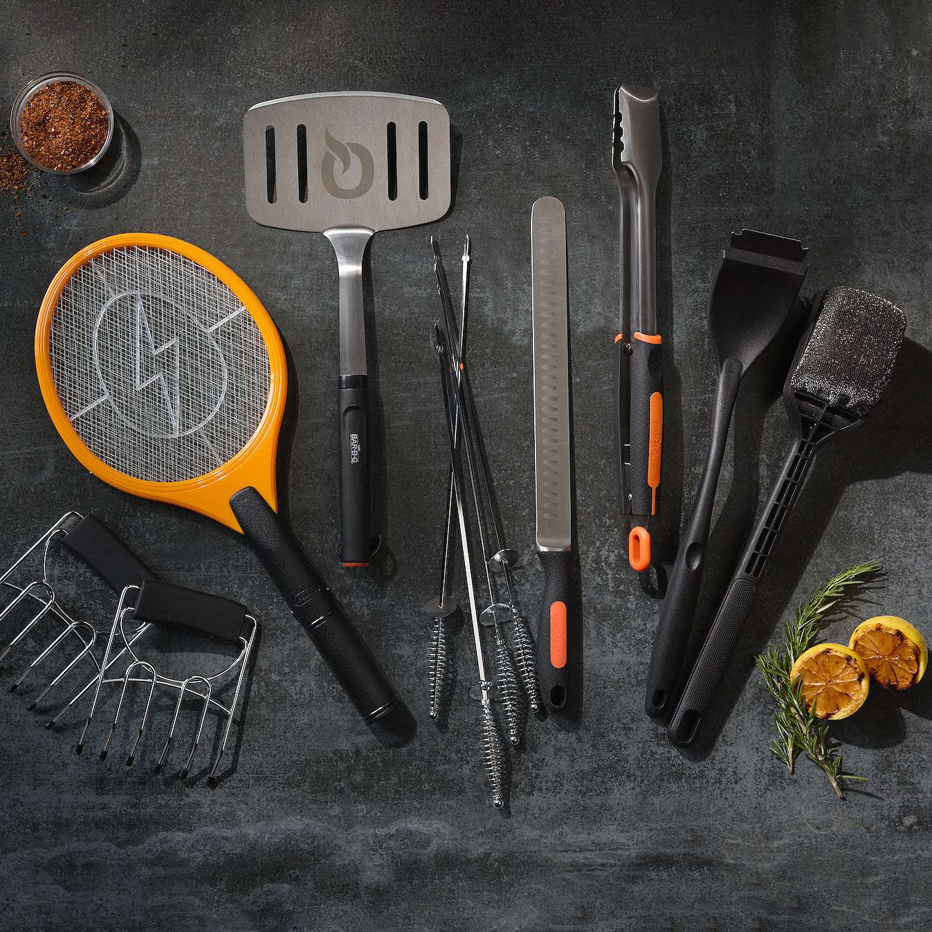 Orange and black handheld bug zapper resembling a tennis racket, featuring a mesh grid for eliminating insects.