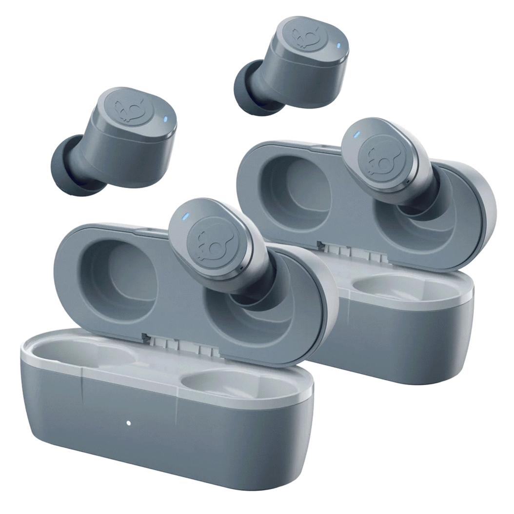 A pair of Skullcandy wireless earbuds are shown with charging cases, featuring a compact, sleek design in gray. Each earbud has a small blue indicator light and a distinctive logo, emphasizing their portable and user-friendly design.