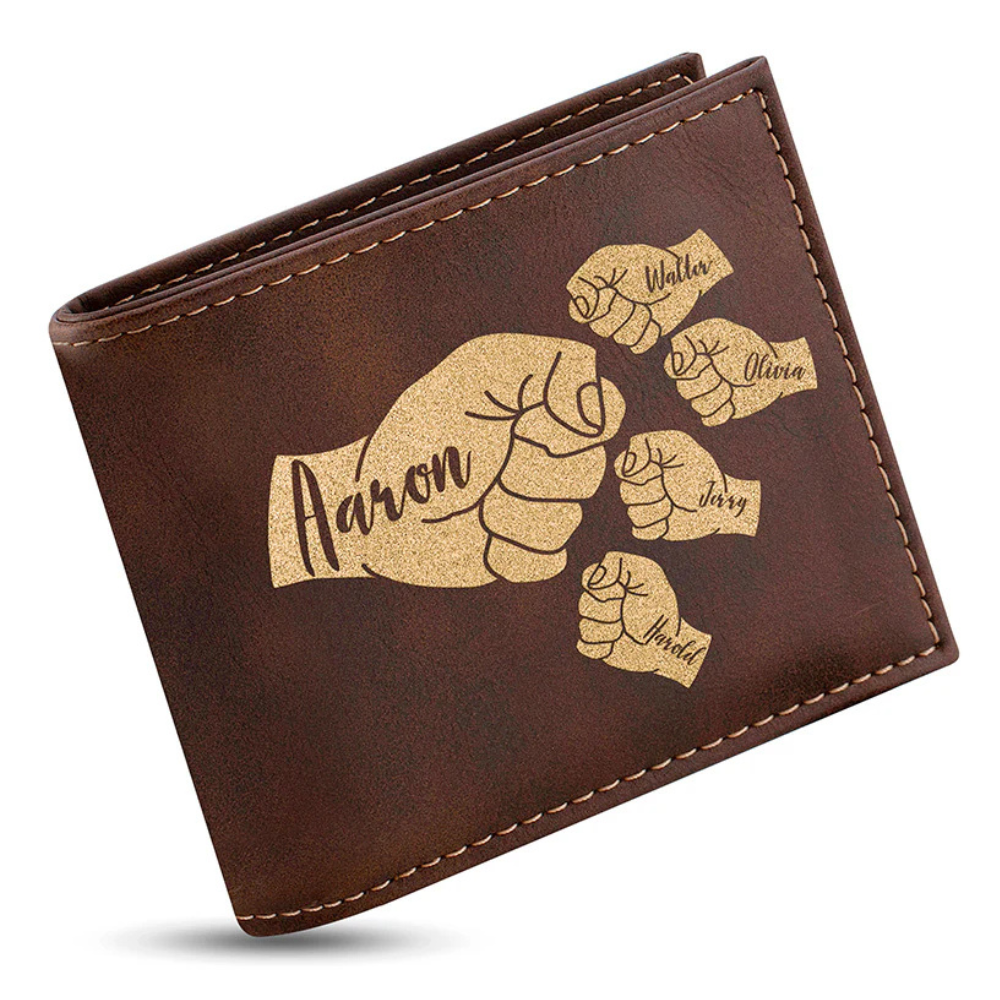 A brown leather wallet features an engraved design of fist bumps, each labeled with names: Aaron, Walter, Olivia, Jerry, and Harold, in decorative script.