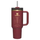 Stanley insulated travel mug with a handle, maroon color, gold design, and straw top.