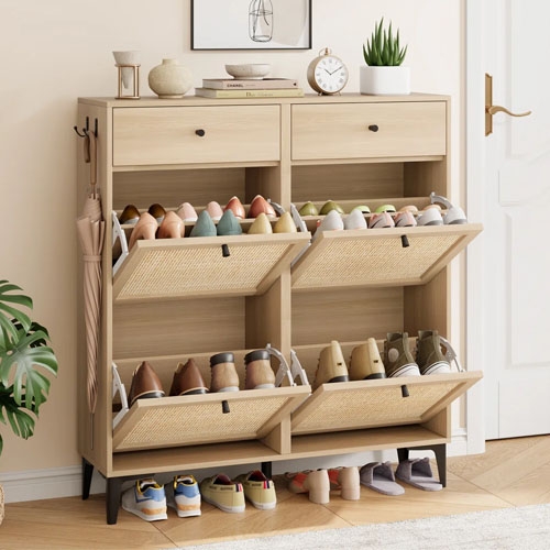 A wooden shoe cabinet with three pull-out drawers for shoe storage, featuring rattan fronts and a small top shelf with two drawers.