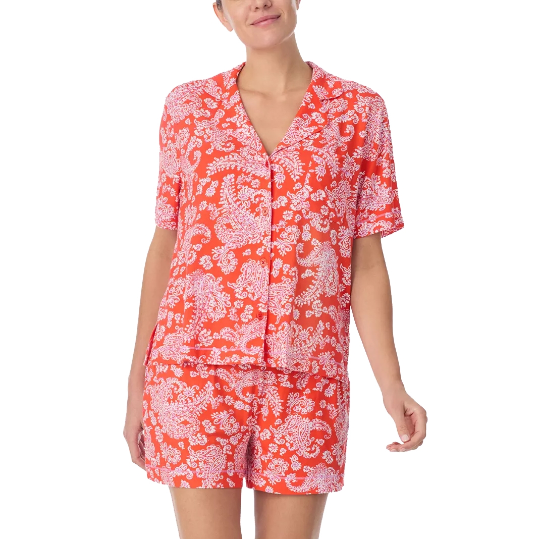 A red and white patterned pajama set featuring a short-sleeved button-up top and matching shorts.