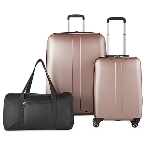 Two wheeled suitcases in rose gold and a black duffel bag.