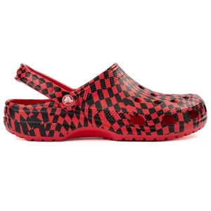 Red and black checkered Crocs clog with ventilation holes and an adjustable heel strap.