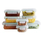 A collection of clear, airtight food storage containers filled with various foods such as nuts, corn, and vegetables, featuring snap-lock lids for secure sealing.