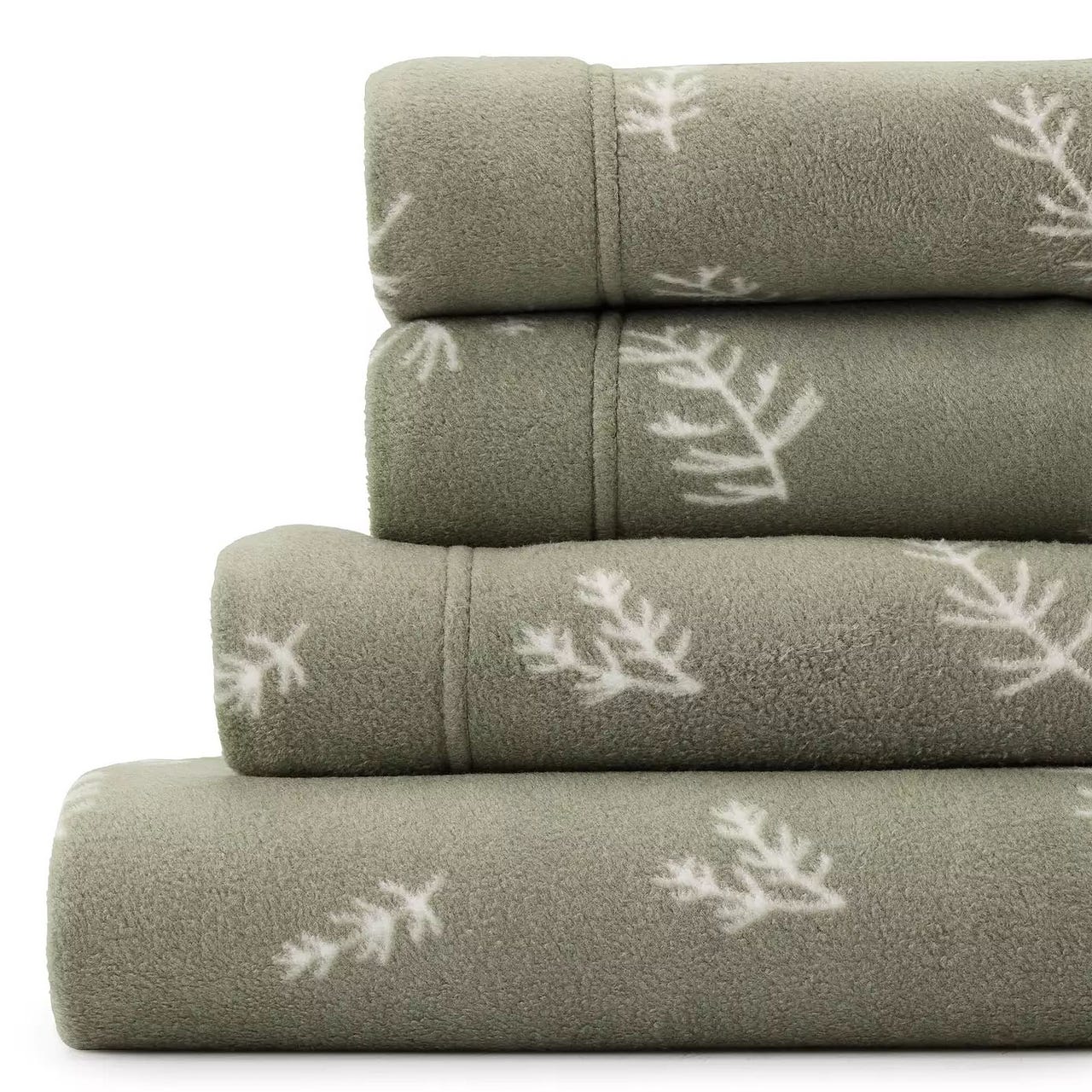 Stacked soft green fleece sheets with a subtle white snowflake pattern.