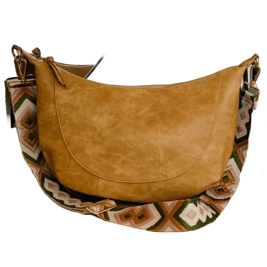 Tan leather shoulder bag with a geometric patterned strap in earthy tones of green and brown.