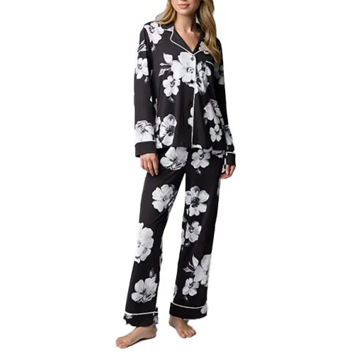 Black floral-patterned pajama set featuring a long-sleeve button-up top and matching pants.