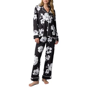 Black floral-patterned pajama set featuring a long-sleeve button-up top and matching pants.