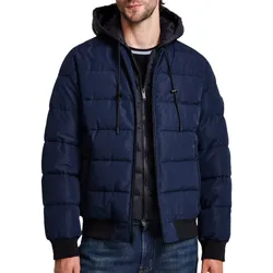 A navy blue quilted hooded jacket with black drawstrings and a front zipper, paired with blue jeans.