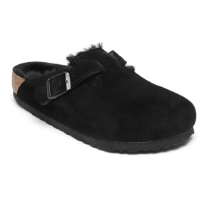 Black suede clog with a buckle strap and shearling lining, featuring a cork and rubber sole.