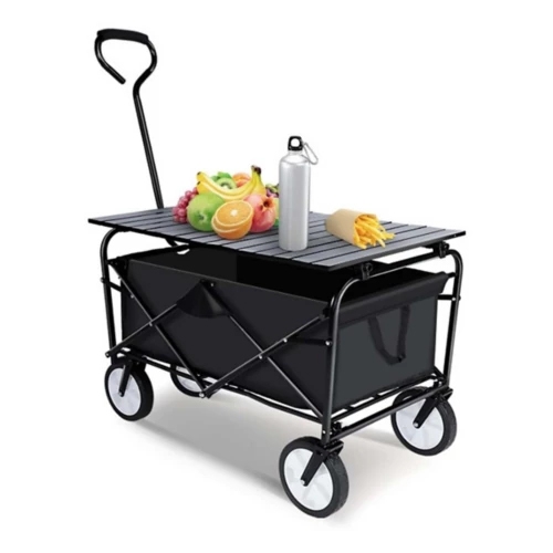 A collapsible wagon with a foldable tabletop, featuring a sturdy handle and four wheels, holds assorted fruits, a water bottle, and wrapped fries. The wagon has a black fabric compartment for carrying items and can be easily moved for convenience.