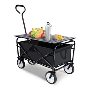 A collapsible wagon with a foldable tabletop, featuring a sturdy handle and four wheels, holds assorted fruits, a water bottle, and wrapped fries. The wagon has a black fabric compartment for carrying items and can be easily moved for convenience.