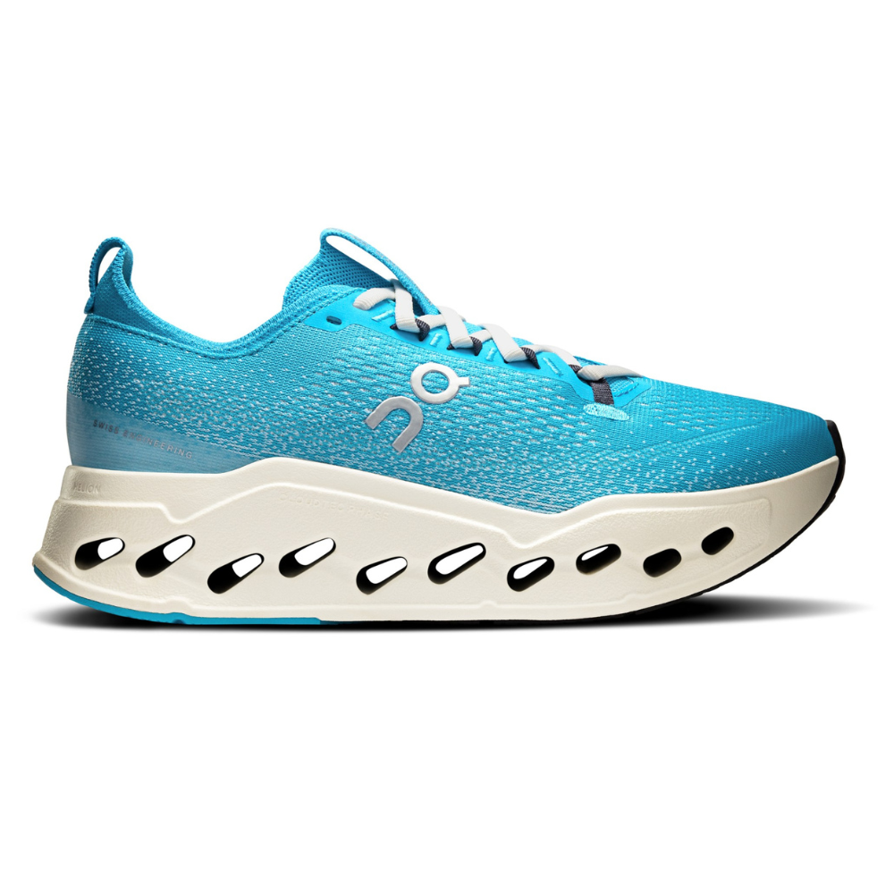 A blue athletic shoe with a unique sole design featuring cut-out details and a logo on the side.