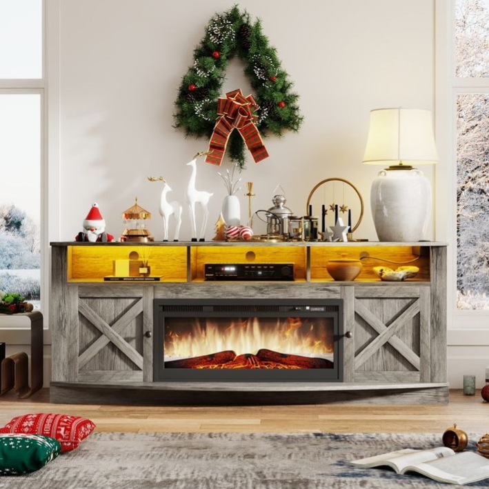 Rustic fireplace TV stand with built-in electric fireplace, holiday decorations, and glowing shelves, adorned with festive items like reindeer figurines and a Christmas wreath.