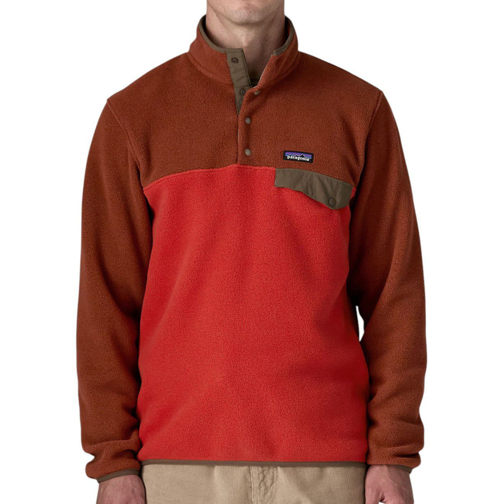 A two-tone fleece pullover with a high collar, buttoned placket, and a small chest pocket featuring a logo label.