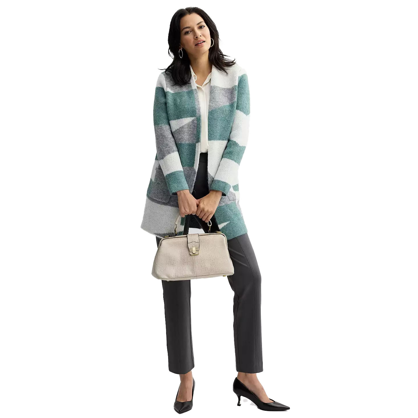 Woman in a striped coat, white blouse, gray trousers, black heels, and holding a beige handbag.