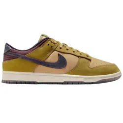 Nike Dunk Low sneaker in earthy tones featuring a combination of mustard yellow, tan, and dark purple with a textured leather upper and a contrasting midsole.