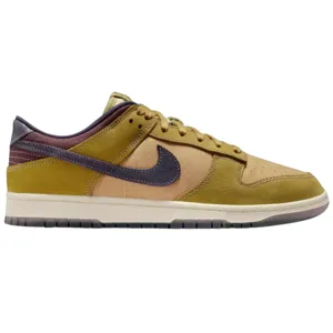 Nike Dunk Low sneaker in earthy tones featuring a combination of mustard yellow, tan, and dark purple with a textured leather upper and a contrasting midsole.