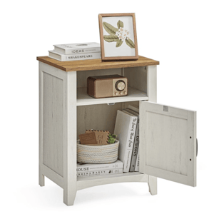 A white and wood accent cabinet with an open shelf and a lower cabinet. It holds a framed picture, books, a vintage radio, and a woven basket.