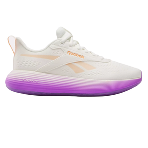Reebok DMX Comfort+ Shoes feature a white upper with peach accents and a distinctive purple gradient midsole. They are designed for comfort with breathable material and cushioning technology.