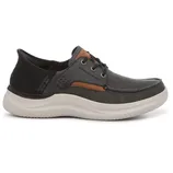 A casual slip-on shoe with a gray fabric upper, white cushioned sole, and black and brown accents. Designed for comfort with lace detailing and \“Sketchers Slip-Ins\“ branding.
