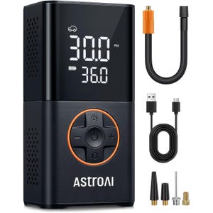 AstroAI Portable Cordless Tire Inflator features an LED display showing PSI and battery level, a USB charging cable, a hose, and multiple nozzle attachments for various uses.