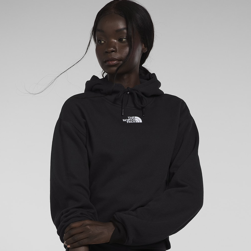 A black The North Face hoodie with a hood and drawstring, featuring a small white logo on the left chest.