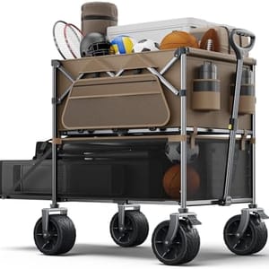 A collapsible utility wagon loaded with various sports equipment including rackets, balls, and containers, featuring large wheels and a sturdy handle for easy transport.