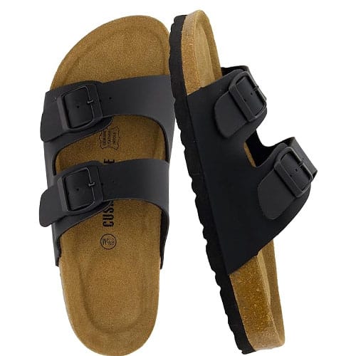 A pair of black double-strap sandals with adjustable buckles and a cork footbed designed for comfort and support.