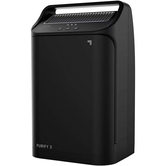A black air purifier with a sleek design labeled \“PURIFY 3,\“ featuring a digital control panel on top.