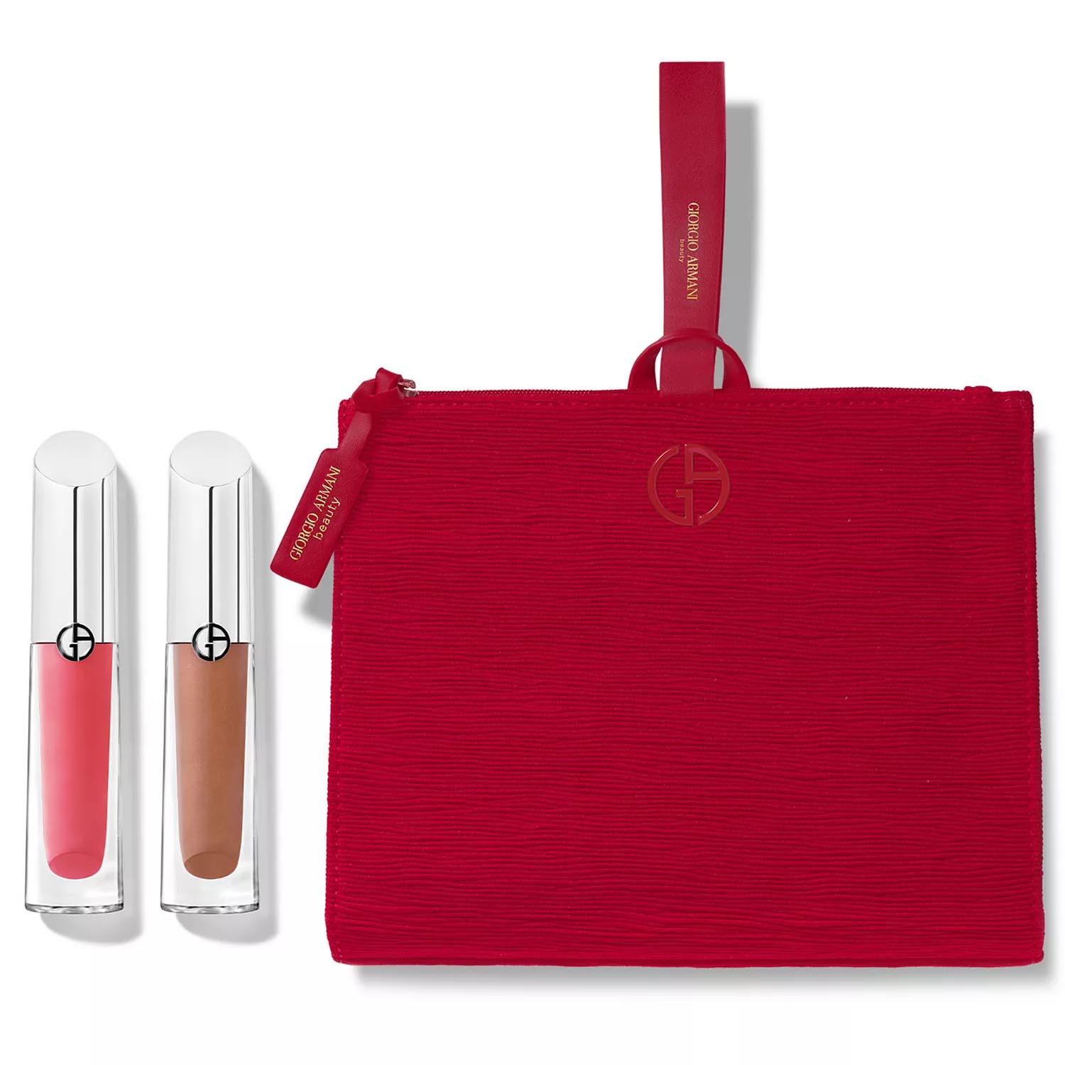 Two Giorgio Armani lip glosses, one in a pink shade and the other in a nude shade, are placed next to a red textured Giorgio Armani pouch with a logo and zipper.