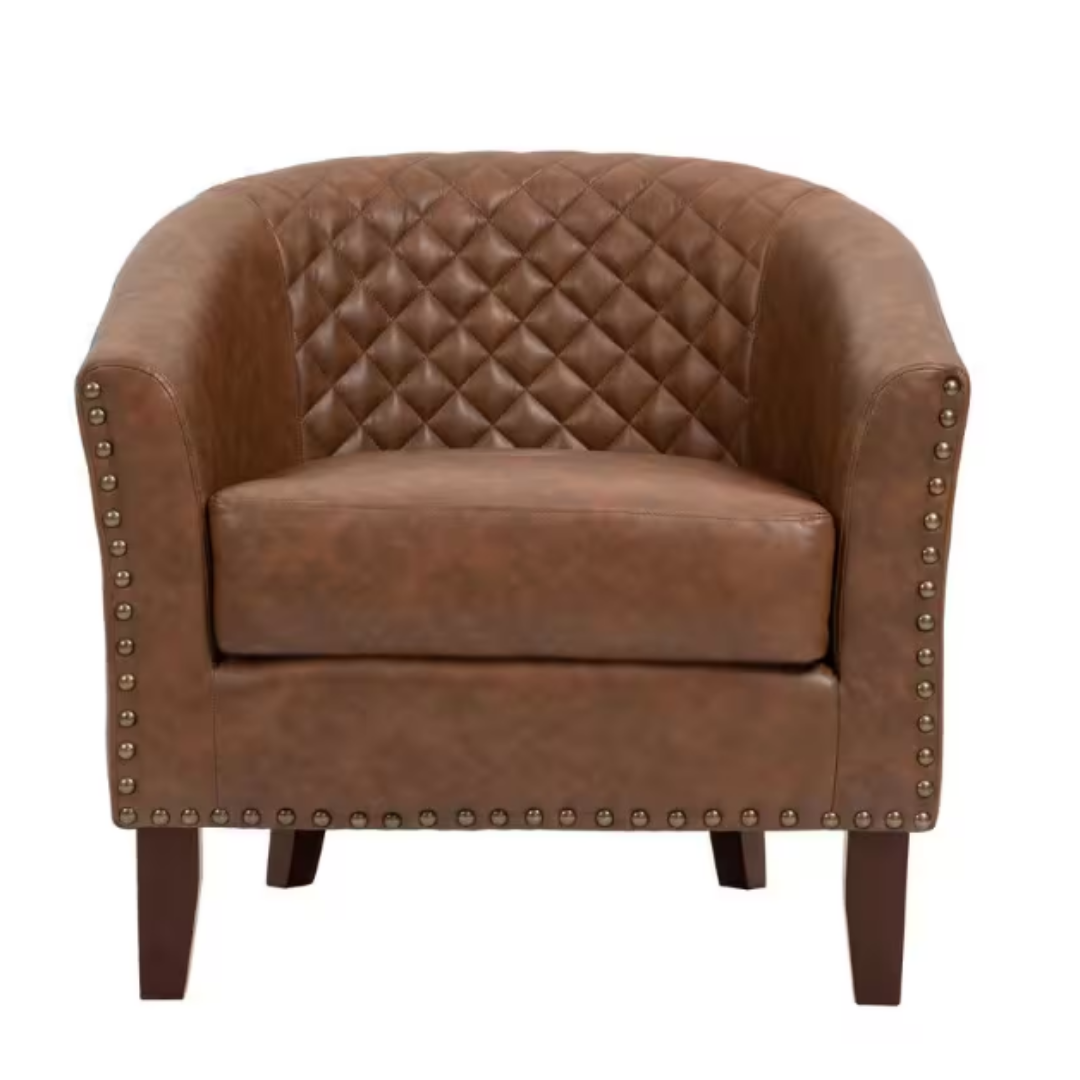 Brown leather armchair with quilted backrest and metal stud trim, supported by wooden legs.